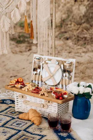 Food and glass decor in wicker basket hamper