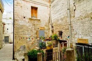 Medieval town street with old stone buildings.