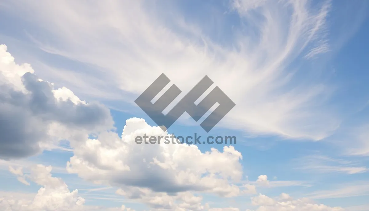 Picture of Summer sky with fluffy clouds and bright sunshine