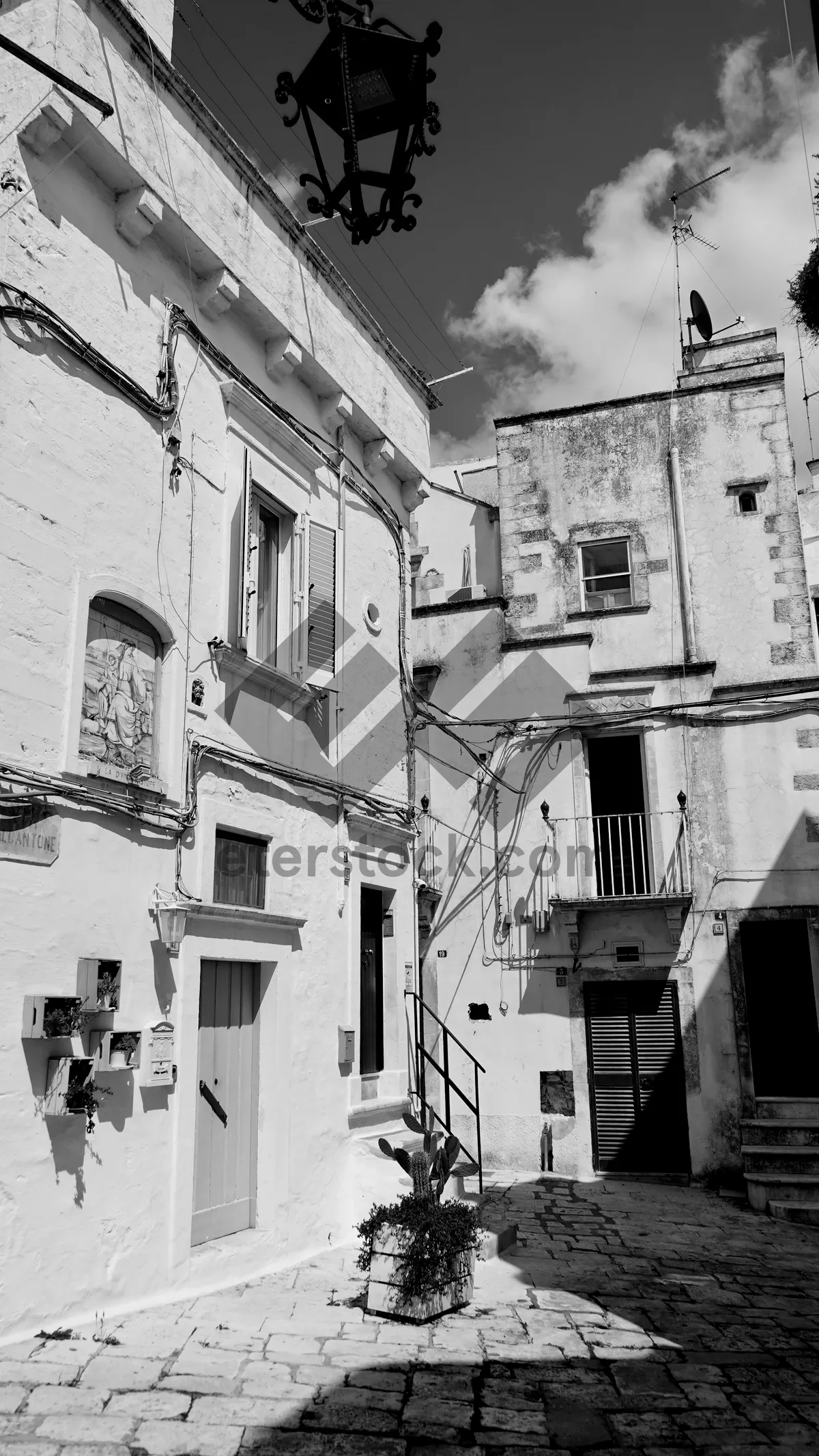 Picture of Old brick building with balcony and air conditioner.