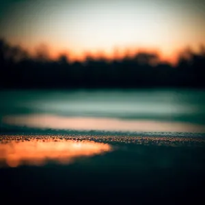 Golden Horizon: Tranquil Sunset Reflection on the Water