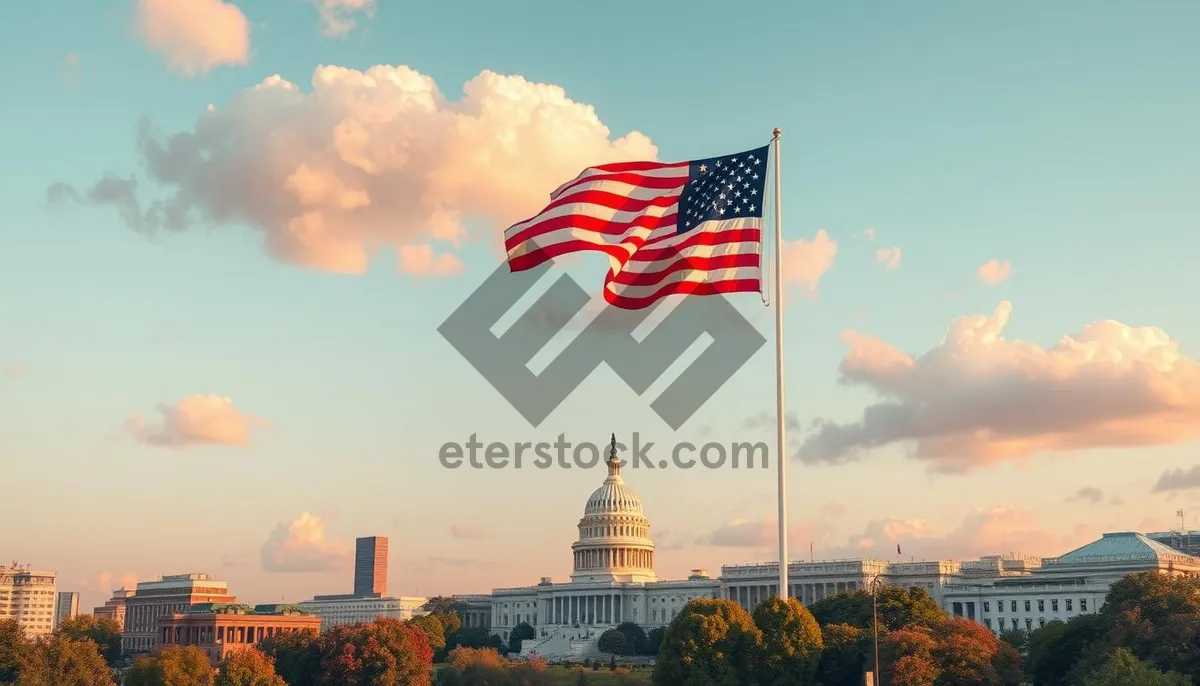 Picture of National flag flying high against blue sky