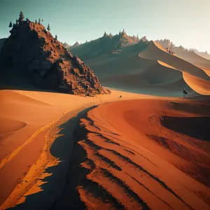 Desert Dune Sunset: Majestic Sand Mountains under Orange Sky