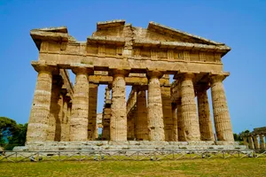 Ancient Roman Temple Columns in Historic City Skyline