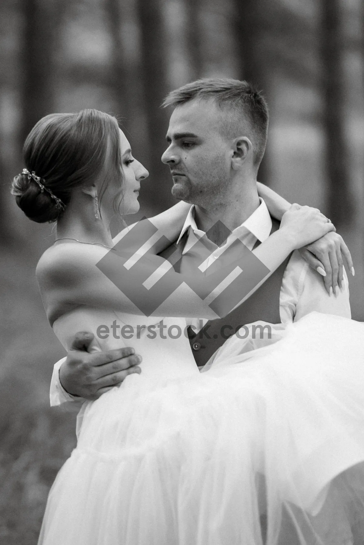 Picture of Happy bride and groom smiling outdoors