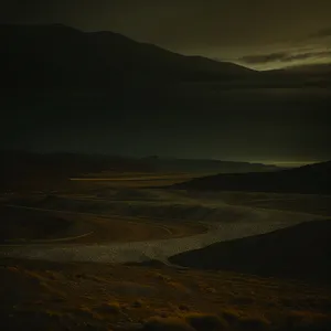 Vast Highlands at Sunset: Majestic Mountains, Desert Plains, and Cloudy Skies