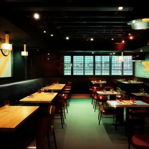 Modern restaurant interior with wooden furniture and lamps.