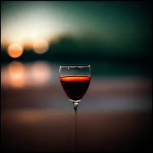Red Wine Glass Against a Grapevine Background