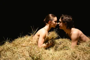 Attractive summer portrait in rural meadow.