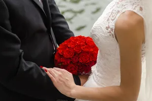 Wedding bouquet held in bride's hands