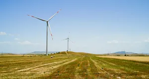 Wind Turbines in a Cloudy Landscape Generating Energy