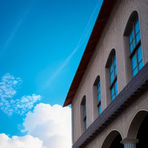 Cityscape View: Ancient Church Tower Over Viaduct