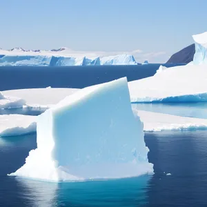 Majestic Arctic Glacier Reflecting Sunlight on Icy Ocean Waters