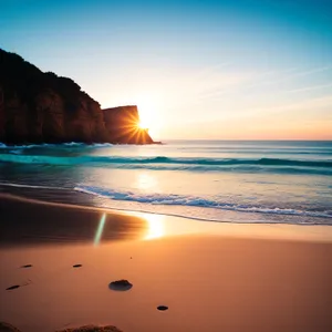 Serene Sunset Beachscape: Tranquil waves caressing sandy coast.