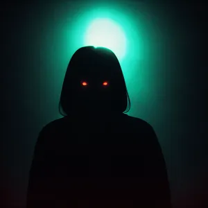 Dark Silhouette of a Masked Man in Robe