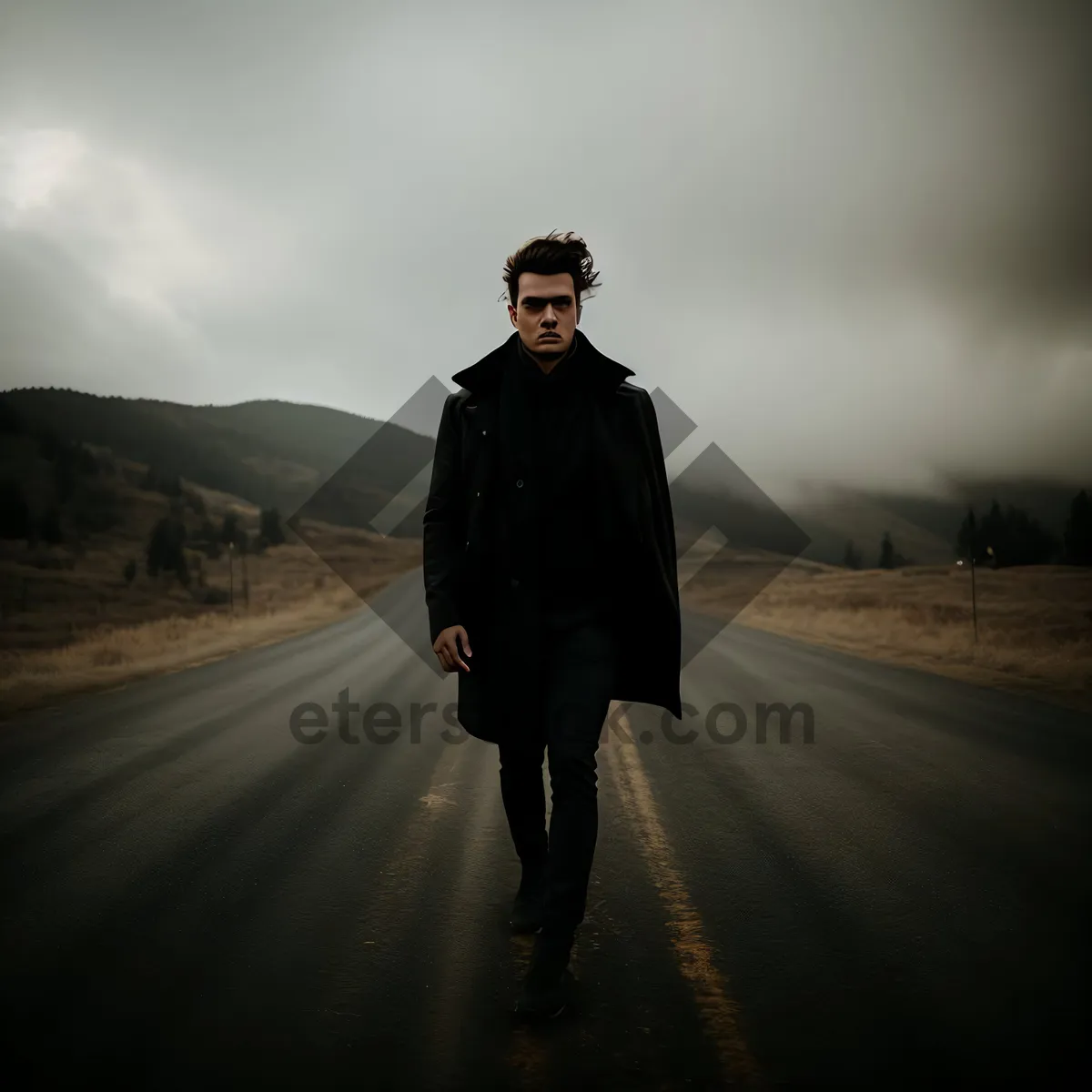 Picture of Silhouette of a man in trench coat at sunset
