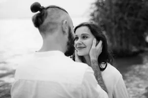 Happy Couple Smiling Together Outdoors at Wedding Portrait