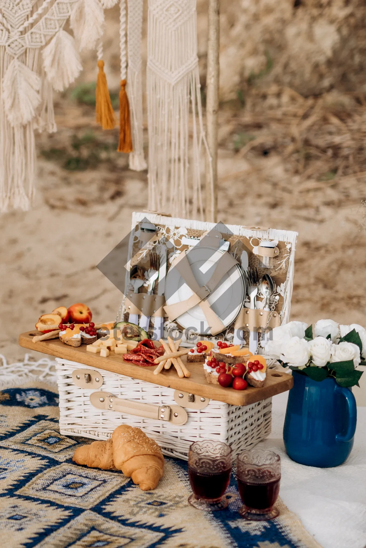 Picture of Food and glass decor in wicker basket hamper