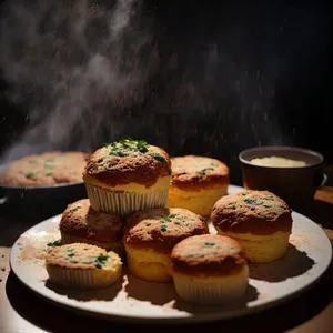 Sweet bakery delight: muffin, cake, and coffee.