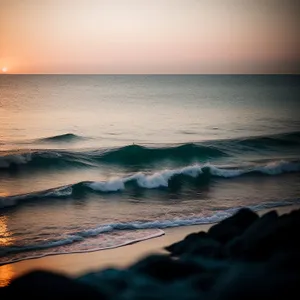 Majestic Coastal Sunset over Tranquil Waters