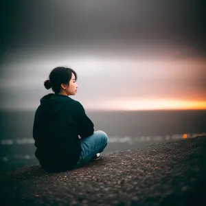 Golden Horizon: Silhouette of Man on Beach at Sunset