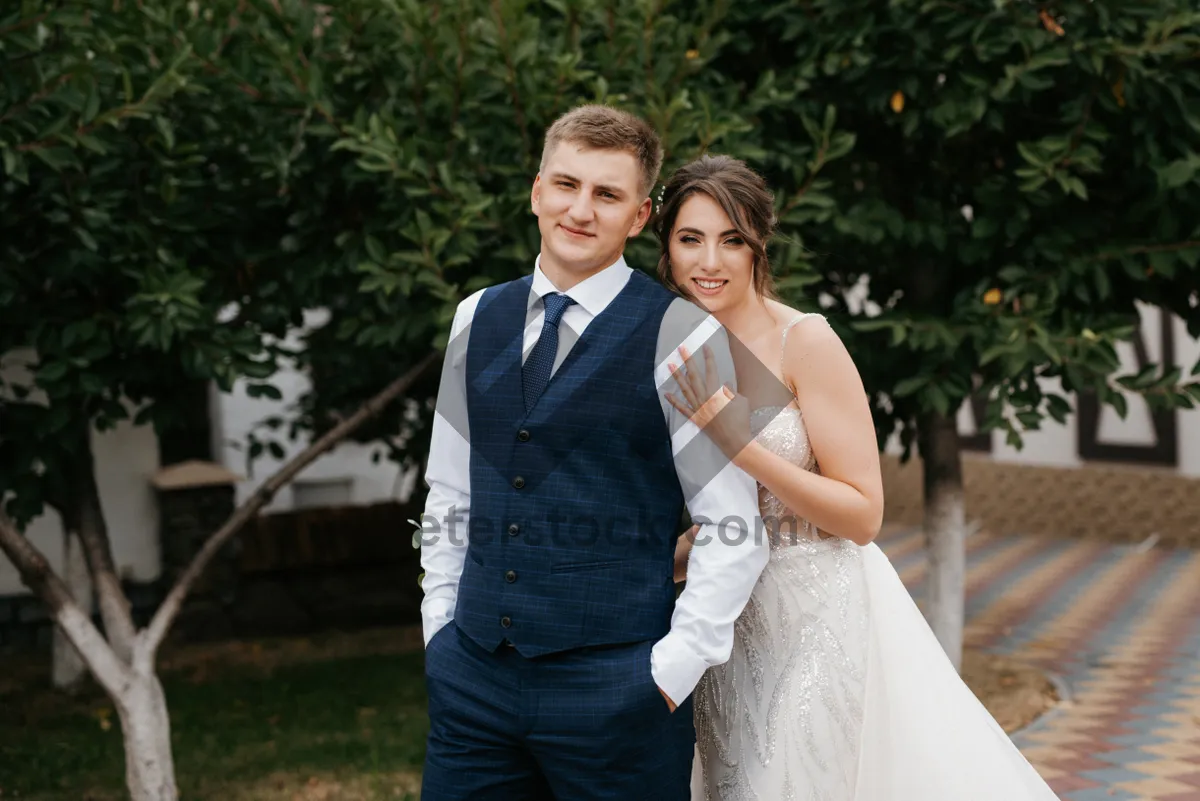 Picture of Happy Wedding Couple Smiling Together Outdoors