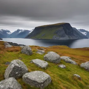 Snowy Mountain Landscape Amidst Majestic Highland Valley