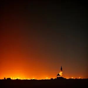 Vibrant Sunset Sky with Silhouetted Landscape