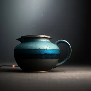 Hot Tea in Ceramic Teapot with Cup
