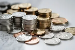 Golden coins stack on business column symbolizing success wealth.