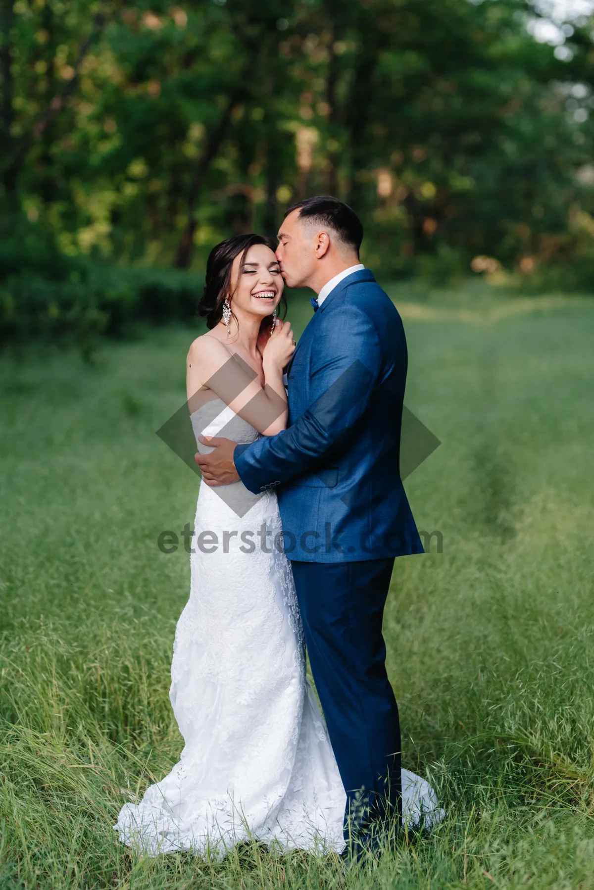 Picture of Happy couple in park on wedding day