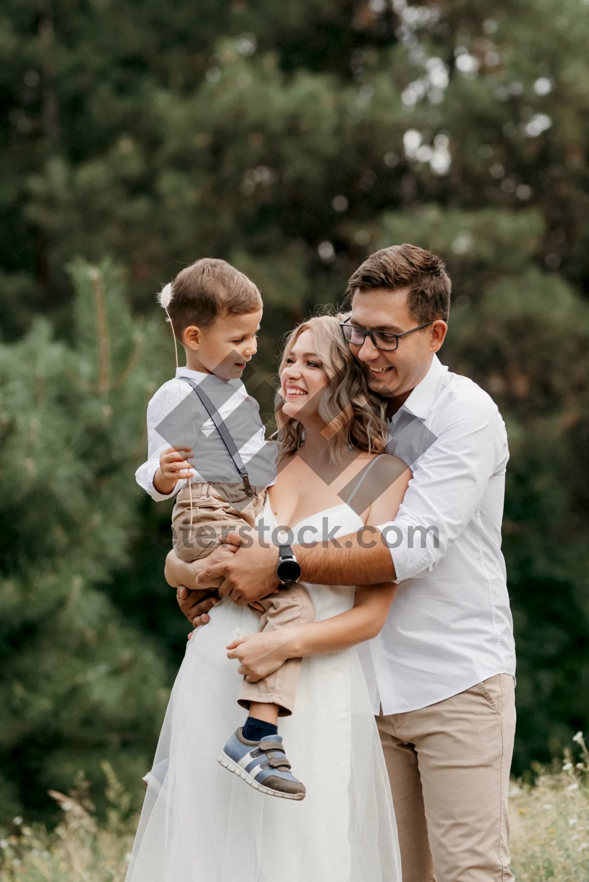 Picture of Happy couple smiling in the park on summer day