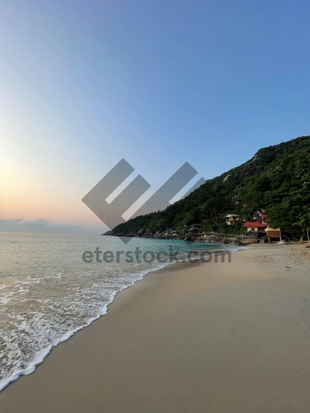 Picture of Tropical beach landscape with waves and palm trees.