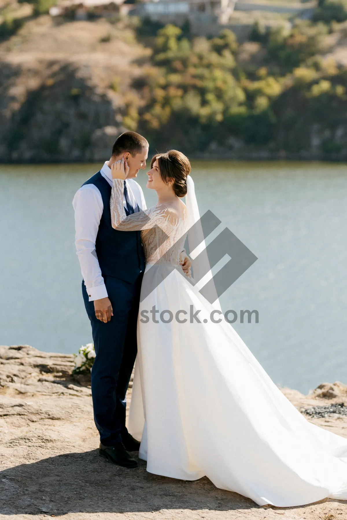 Picture of Happy newlywed couple at beach wedding