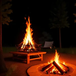 Fiery Blaze: Intense Flames Ignite in a Dark Bonfire