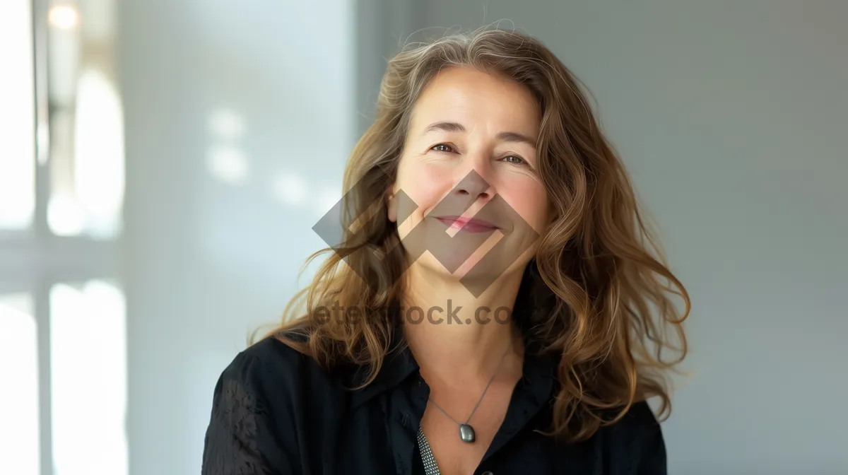 Picture of Professional businesswoman with attractive smile in corporate office.