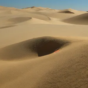 Vibrant Desert Dunes Under Morocco's Sunny Sky