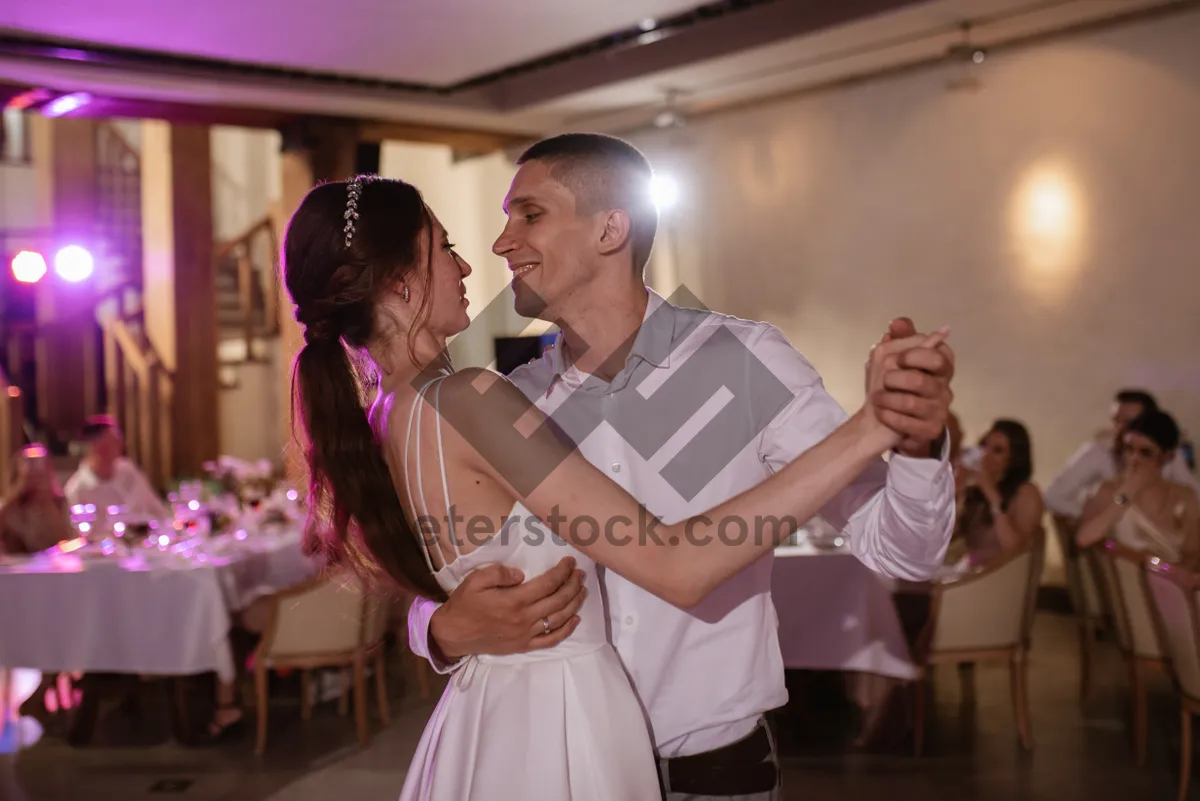 Picture of Happy male waiter serving a couple in love