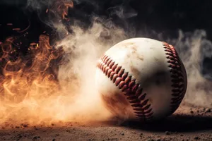 Close-up of baseball glove on sand