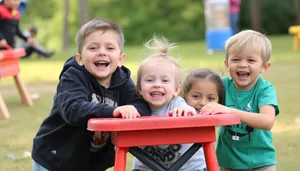 Happy Family Enjoying Summer Picnic in Park