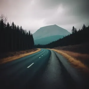 Serene Mountain Highway Through Lush Forest