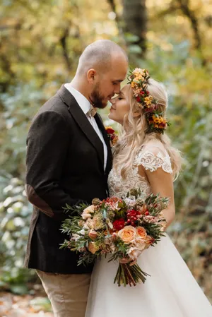 Happy Couple Embracing Outdoors at Wedding Celebration