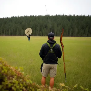 Active Golfer Swinging Club on Golf Course