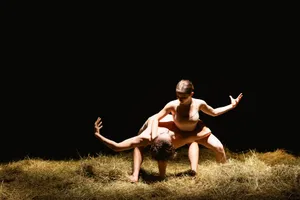 Happy woman jumping in sunny meadow field