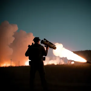 Silhouetted Man Playing a Brass Cornet at Sunset