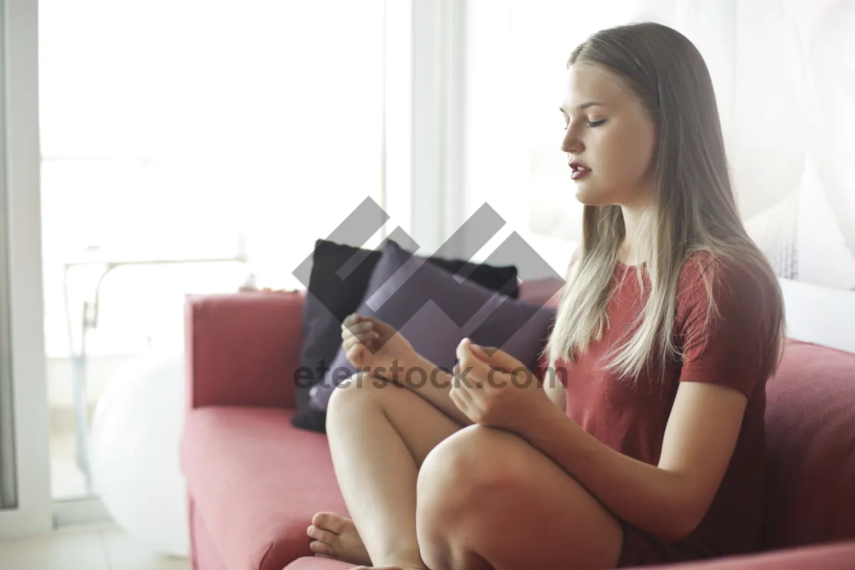 Picture of Attractive brunette businesswoman working on laptop at home