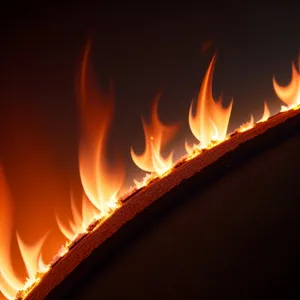 Blazing Heat: Fiery Candle Flames Illuminate Dark