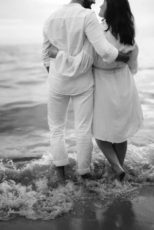 Happy family stroll on beach during summer vacation.