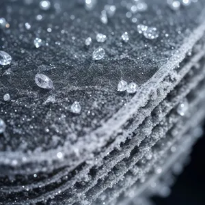 Glistening Dewdrops on a Frosty Cobweb