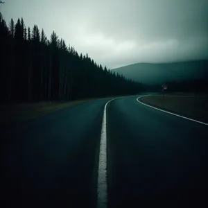 Speeding through scenic mountain landscapes on an empty freeway